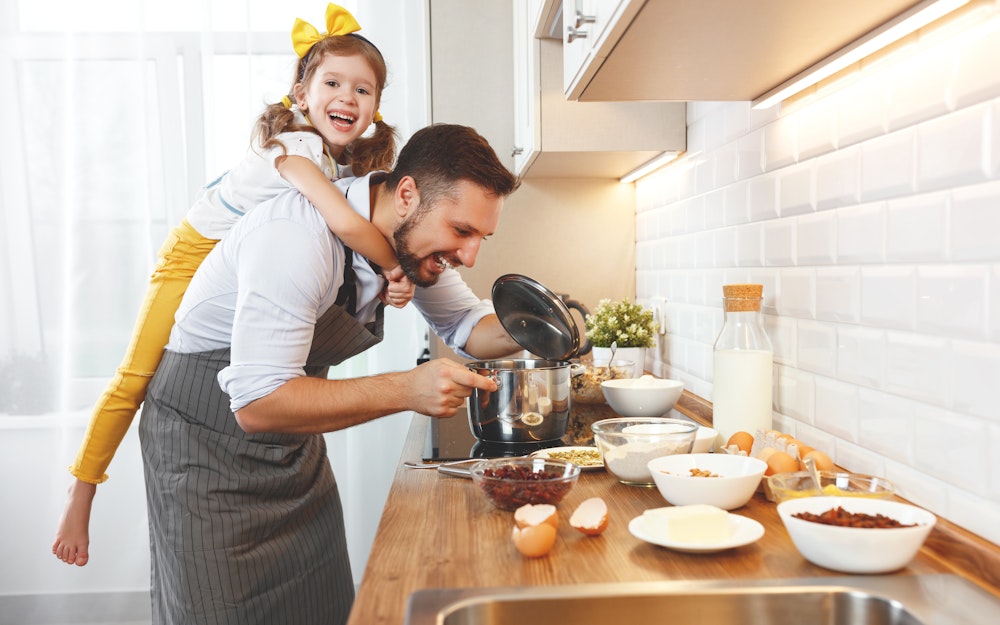 Father and daughter cooking