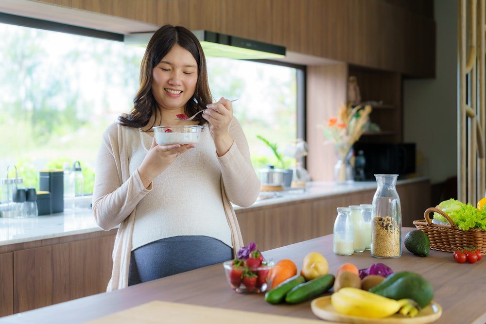 Pregnant woman cooking