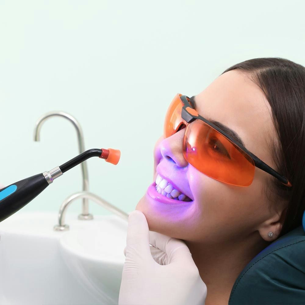 Woman receiving laser dentistry