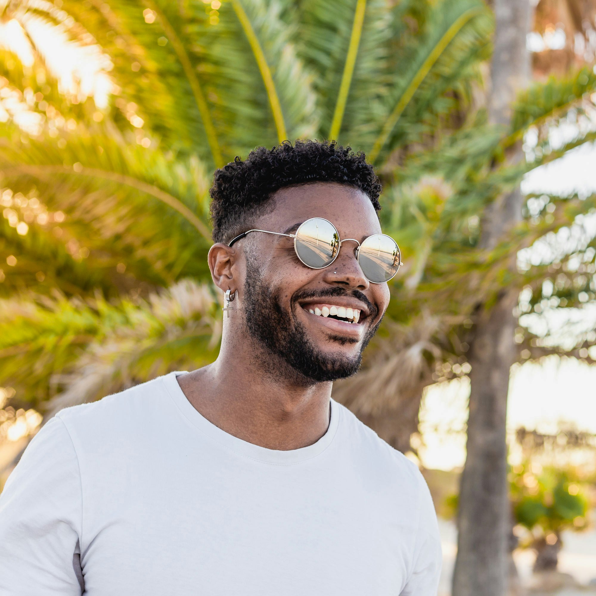 Smiling man wearing sunglasses