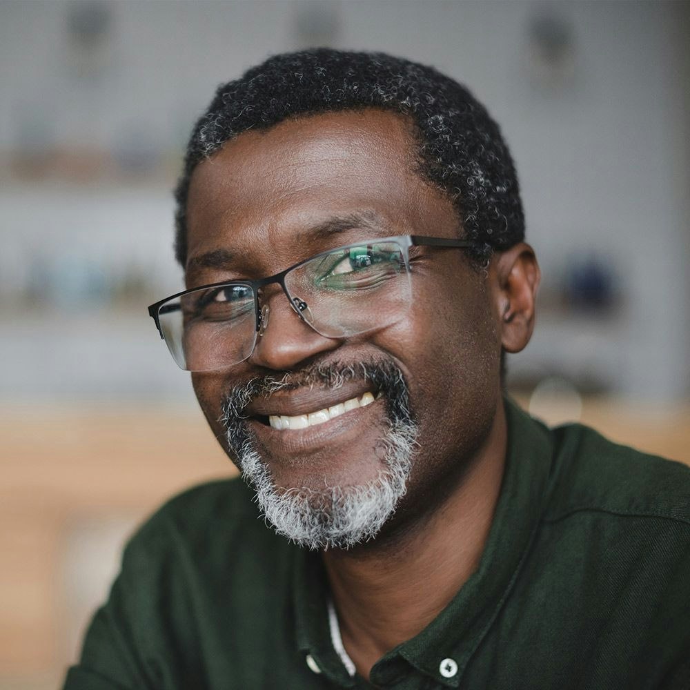 Smiling older man in glasses