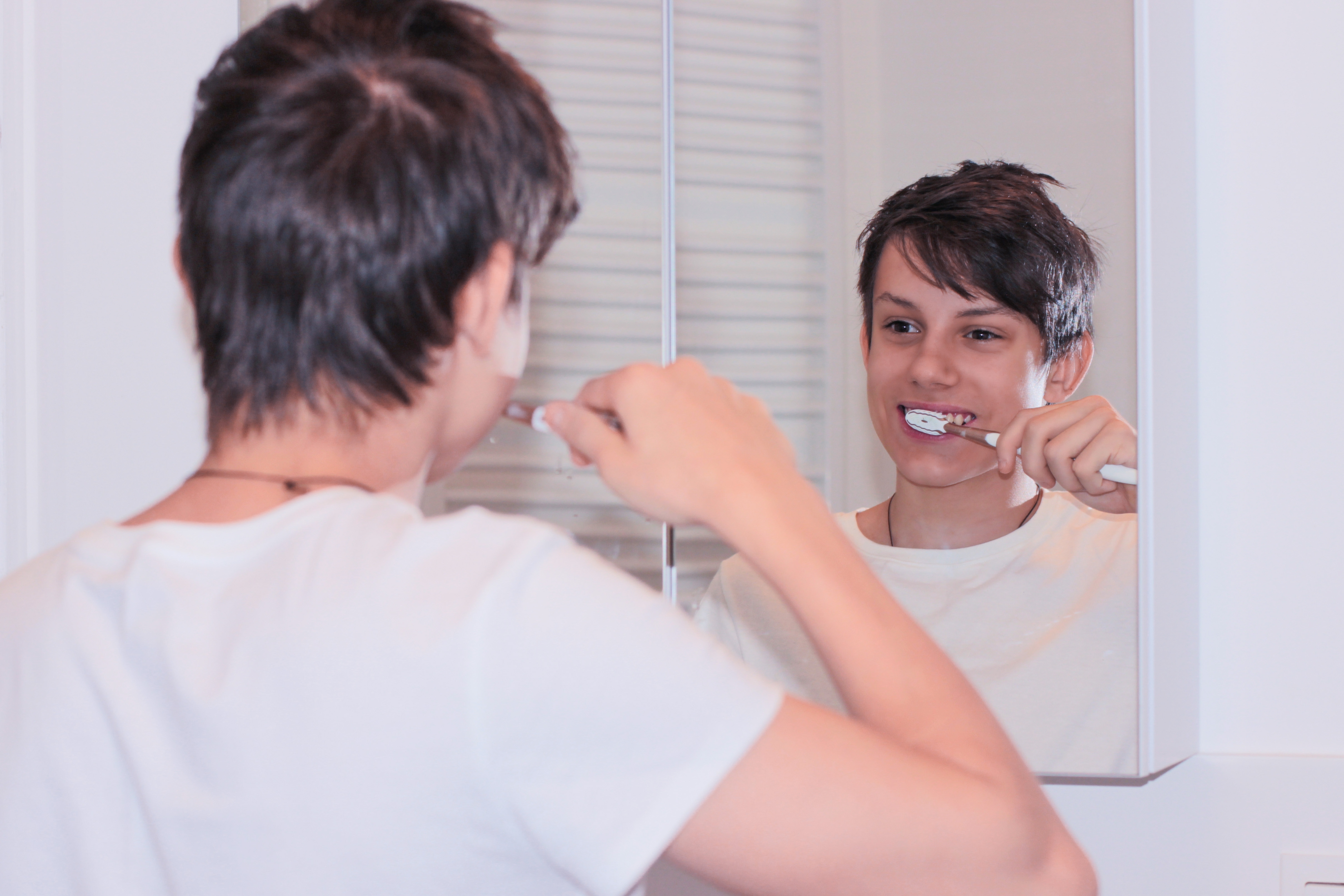 Young man brushing his teeth