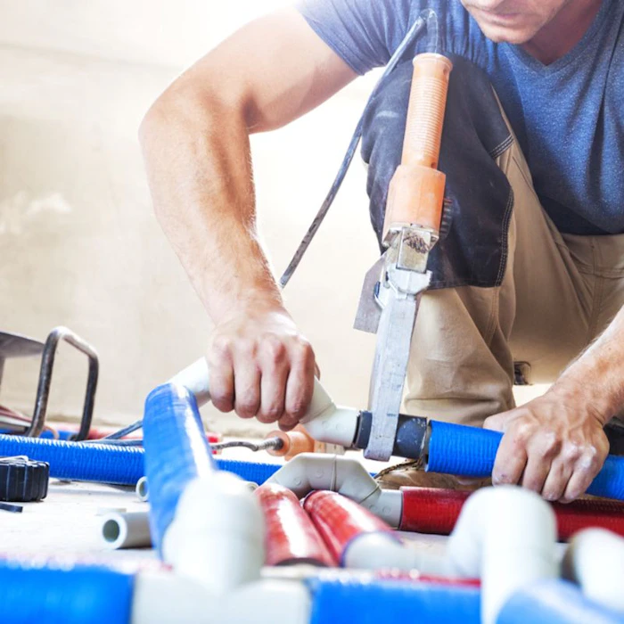 man using a power saw