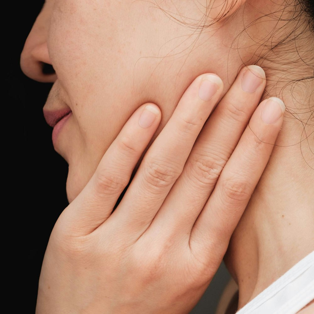 Woman with a tight jaw