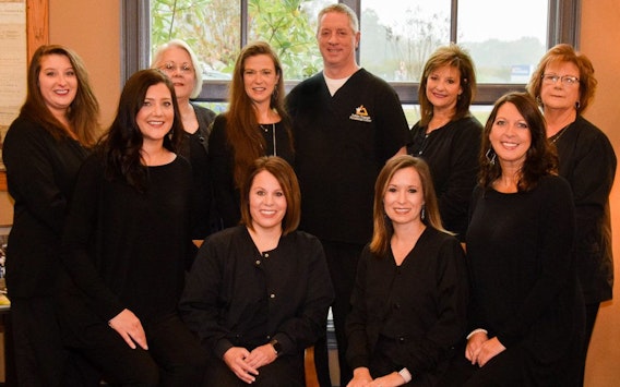 The staff of Golden Triangle Periodontal Center smiling
