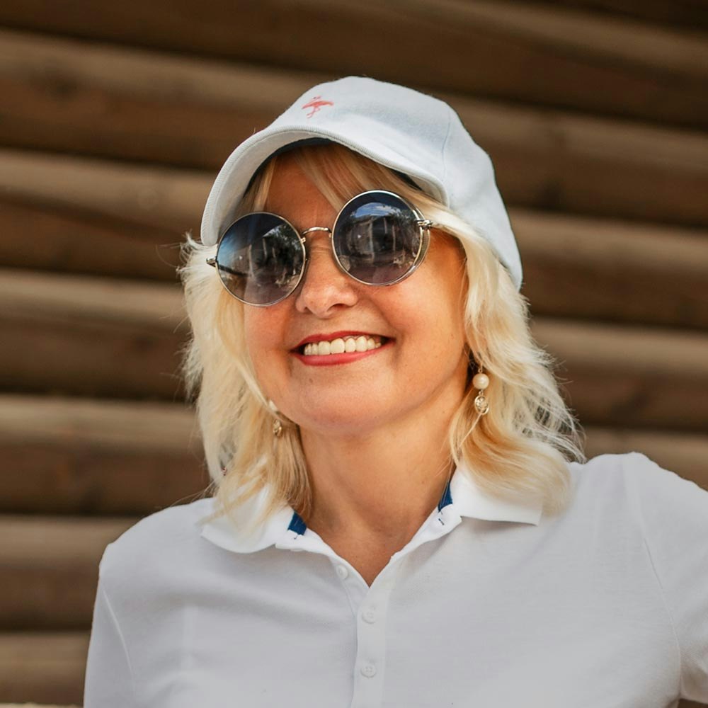 Smiling mature woman after bone grafting and dental implant treatment