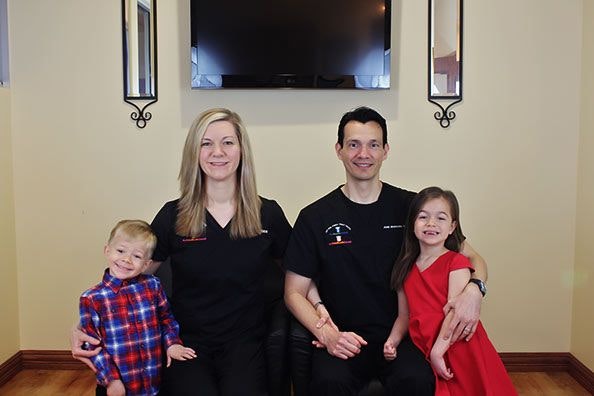 Dr. Ashley Ramsey and Dr. Jose Montoya with their young son and daughter