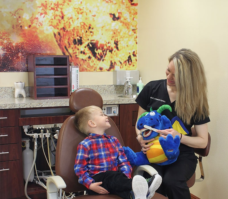 Dr. Ramsey with a happy young patient