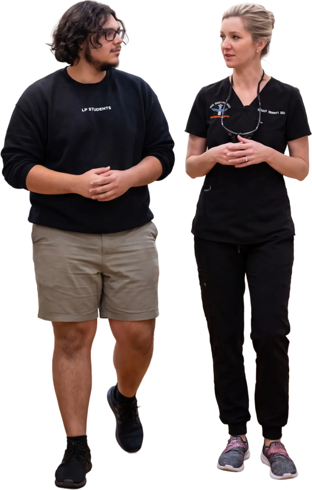 Dr. Ashley Ramsey walking and talking with a patient