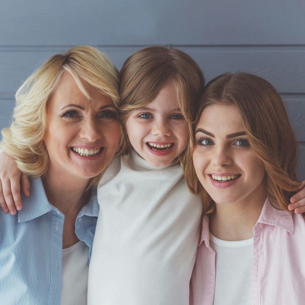 Family of three smiling