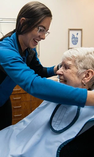 dental hygienist and patient