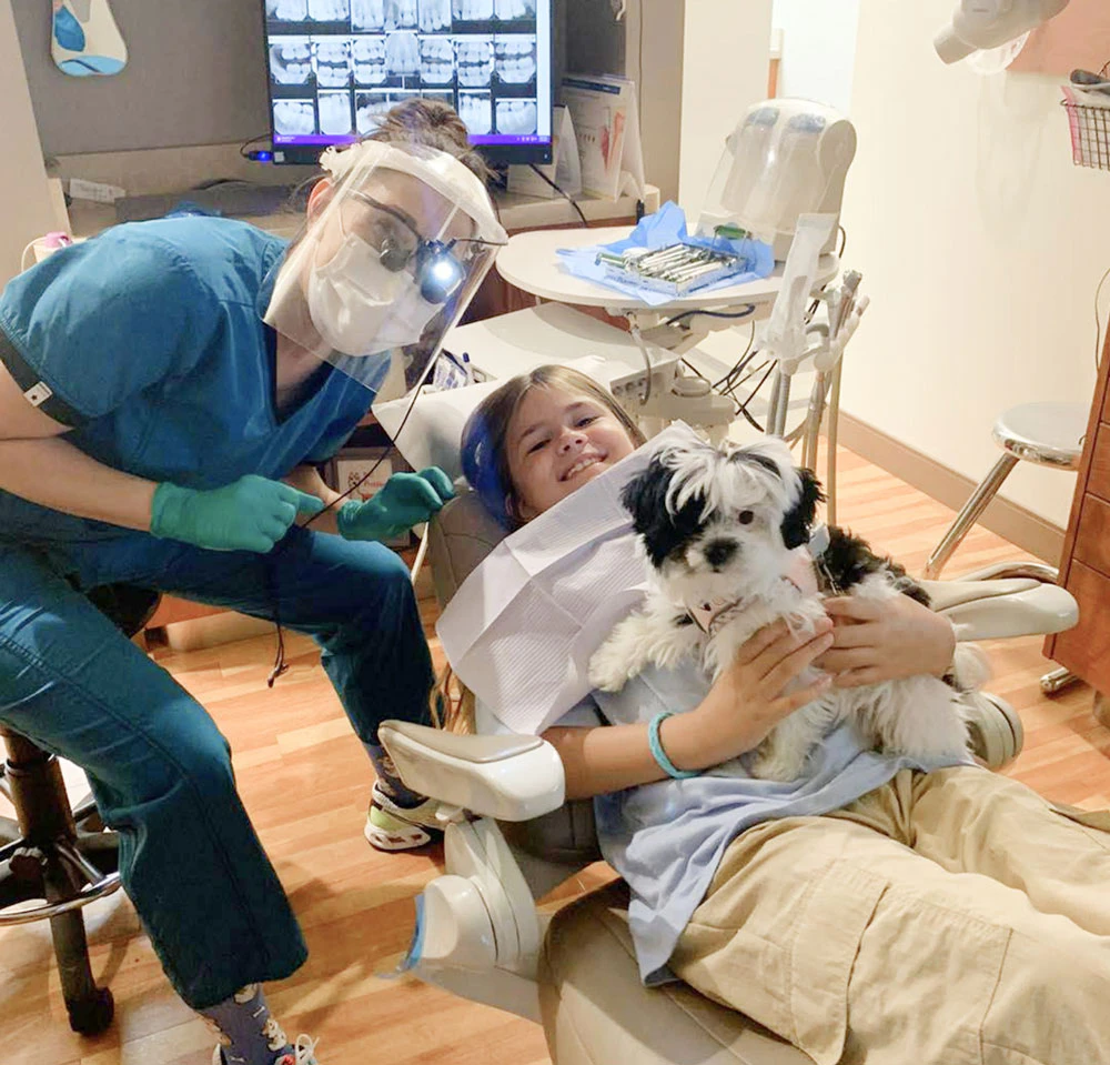 Dentist, patient, and puppy