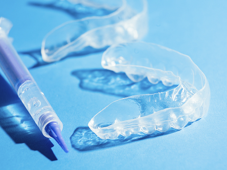 Teeth whitening solution and trays