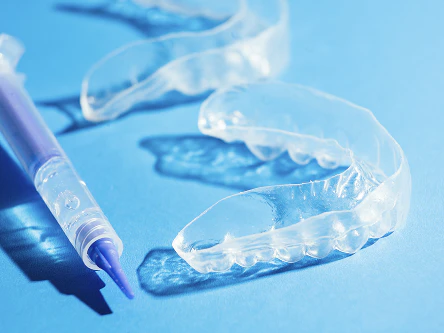 Teeth whitening solution and trays