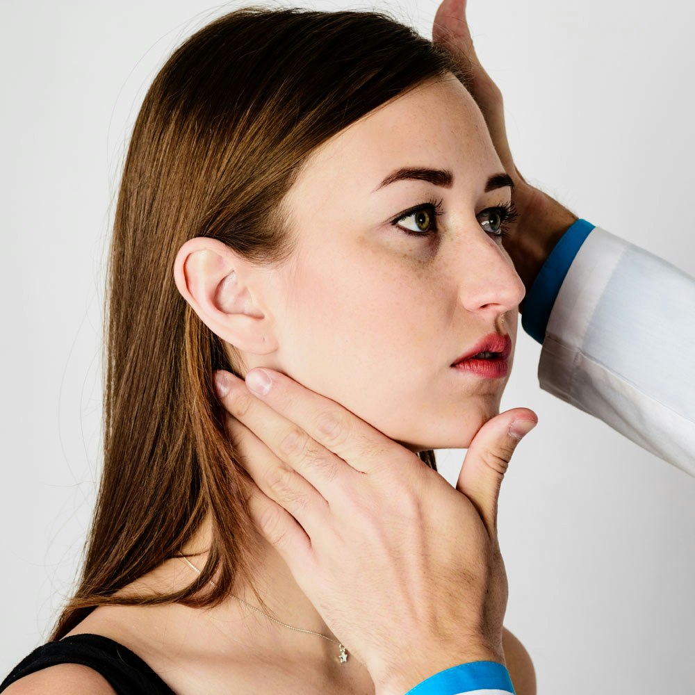 Woman getting her jaw checked