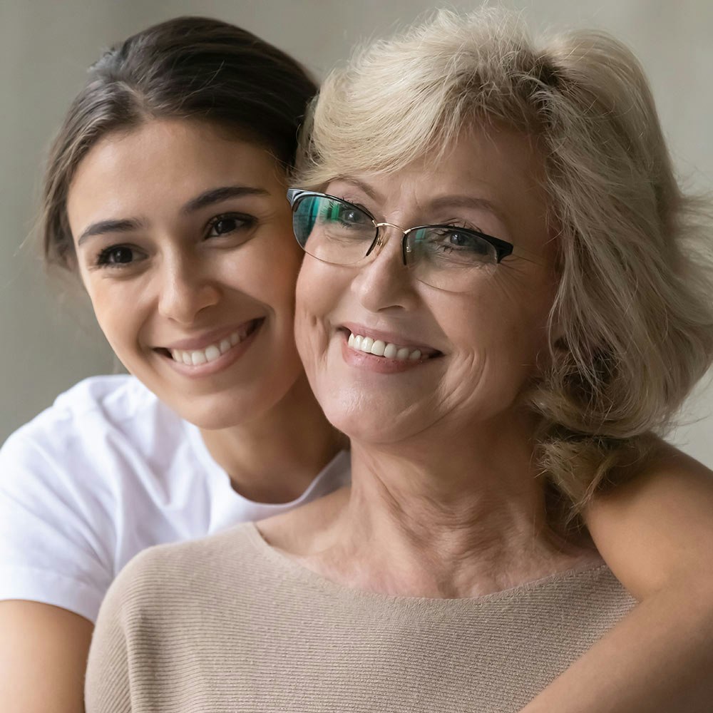 Smiling mature woman with young woman