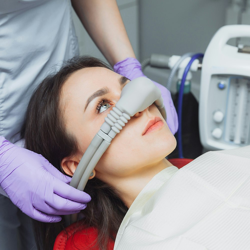 Woman undergoing nitrous oxide sedation