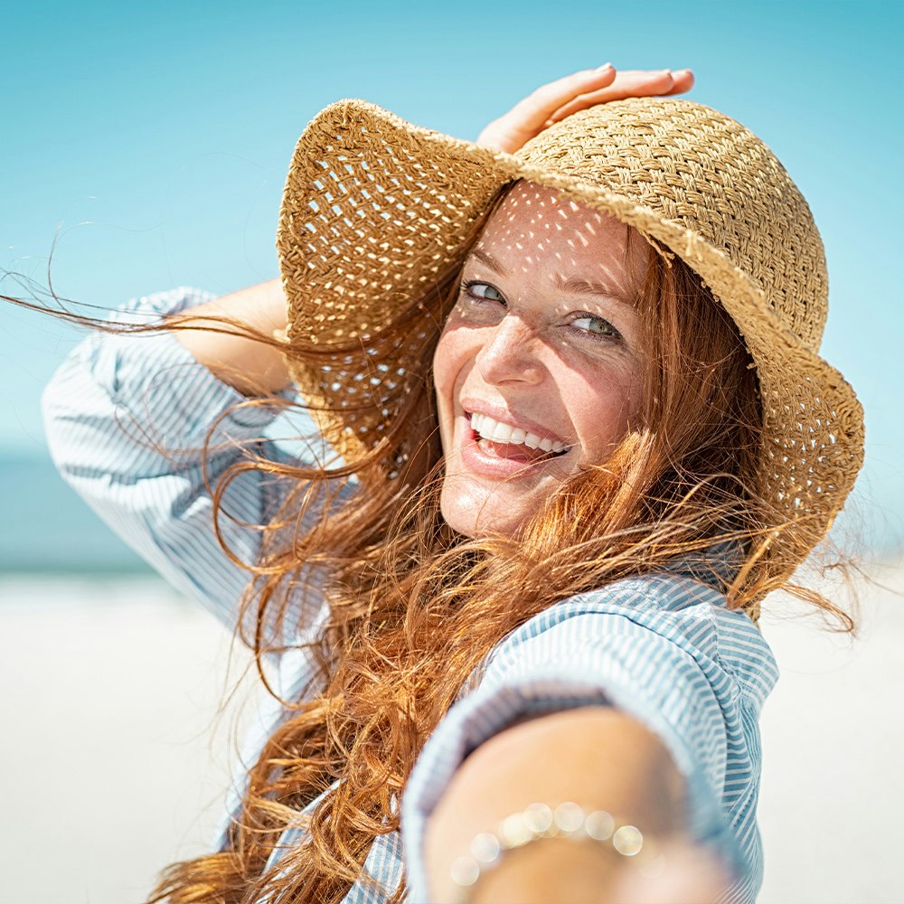 Smiling lady with sun hat