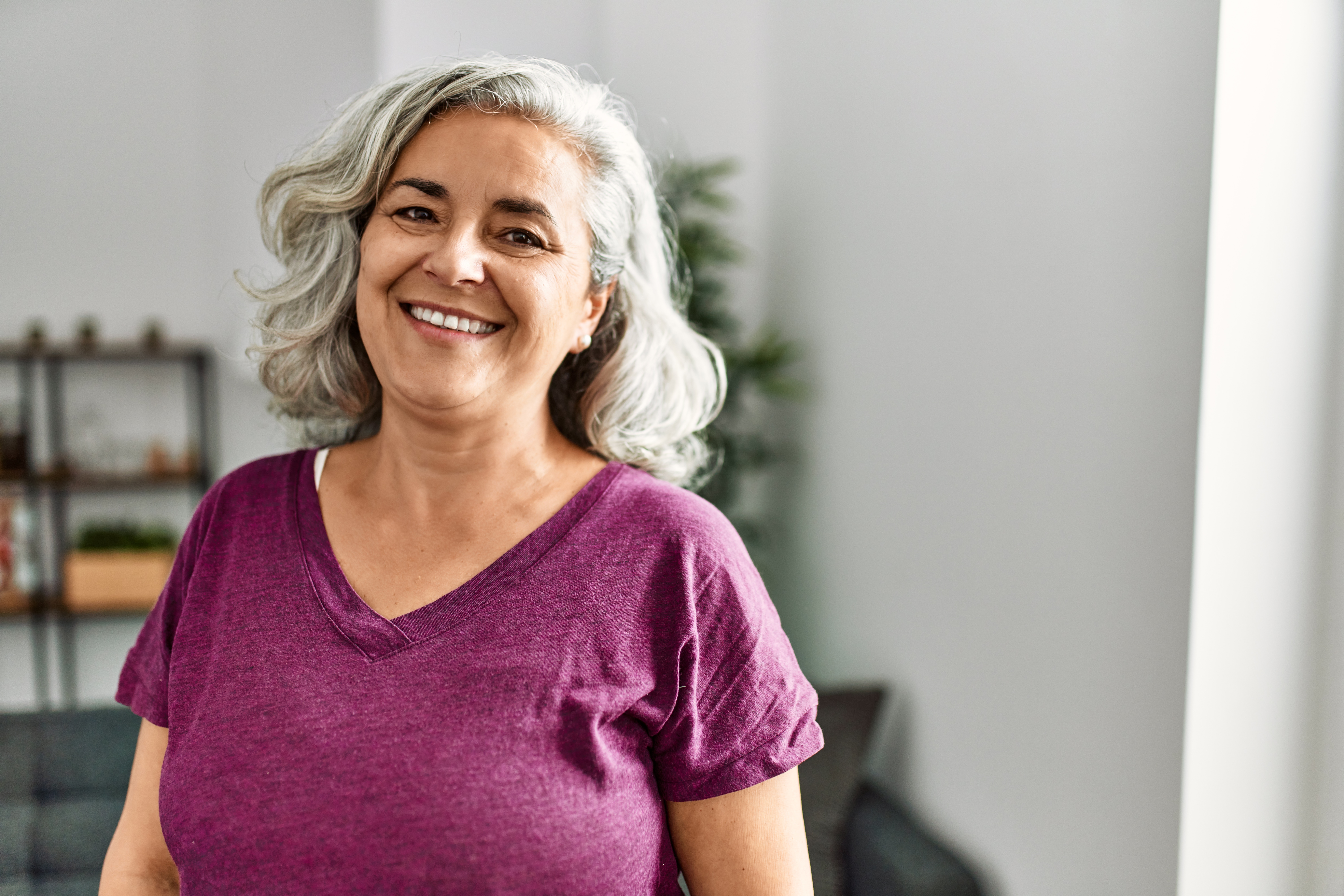 Smiling woman with floral shirt