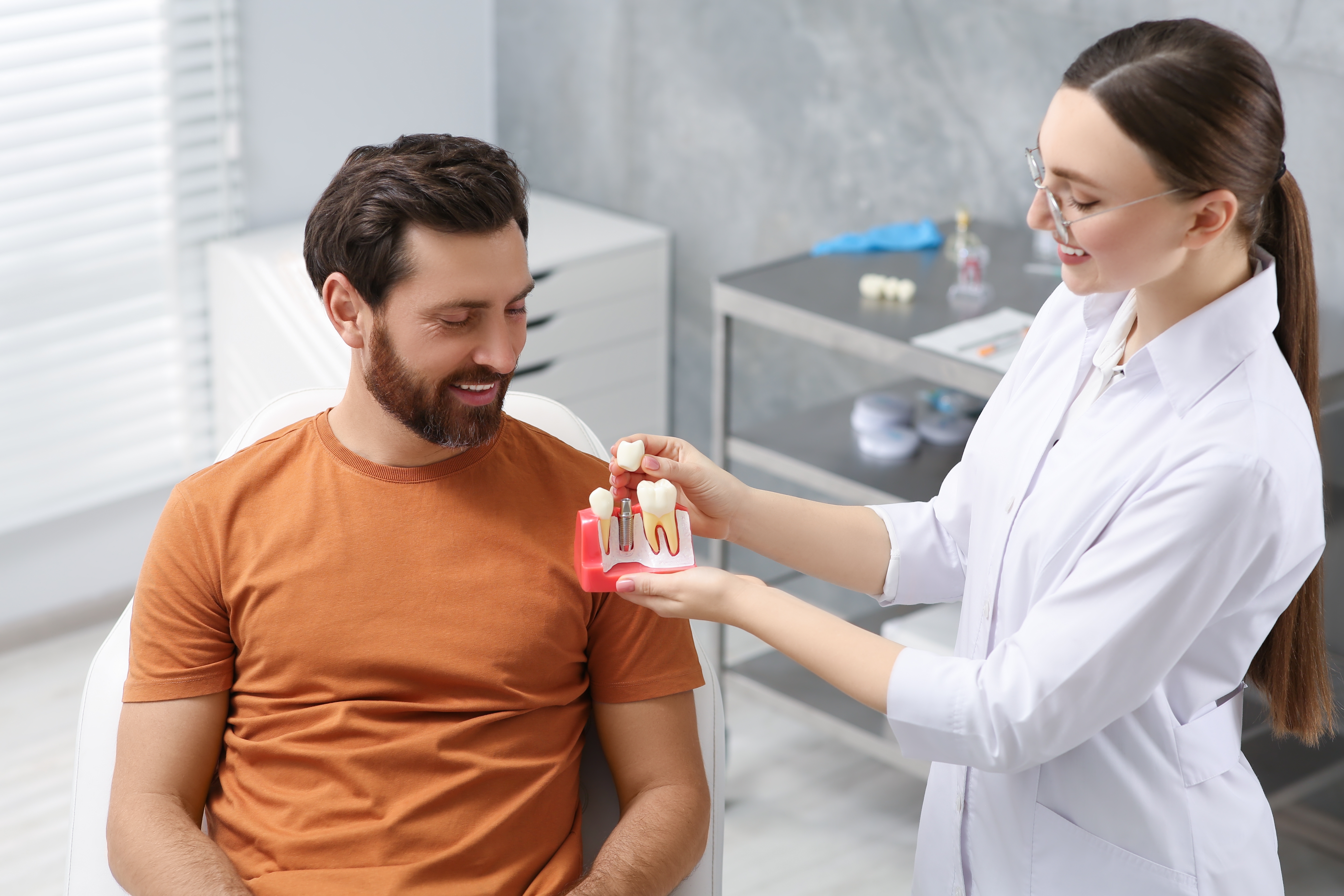 Older woman speaking with dentist