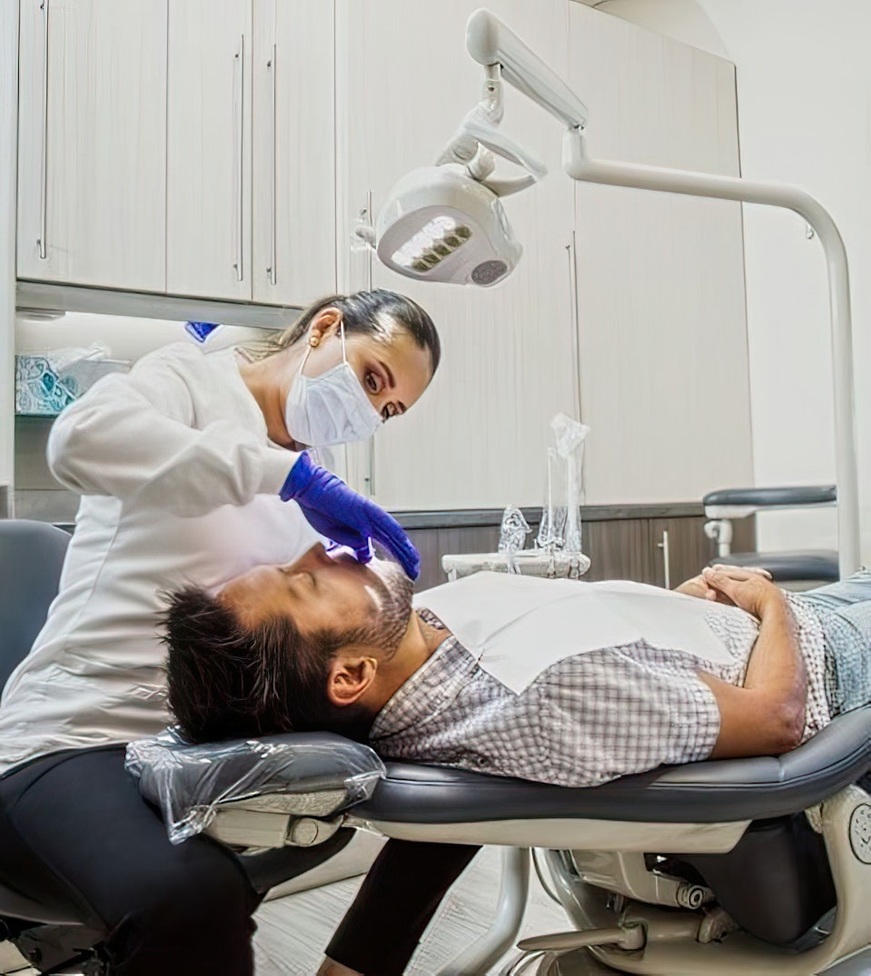 Dr. Falcon with a patient