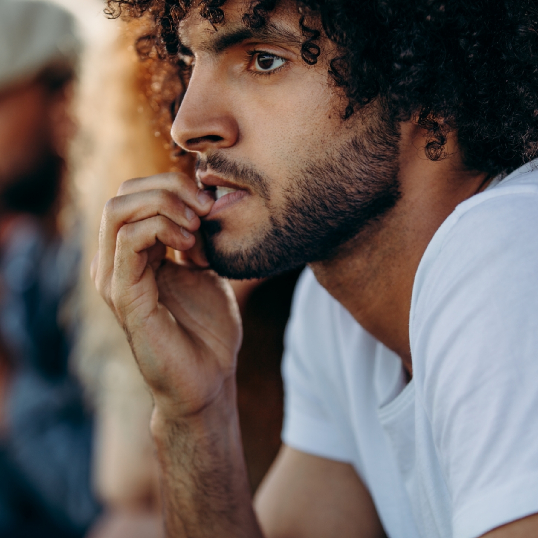 Man with veneers biting his nails