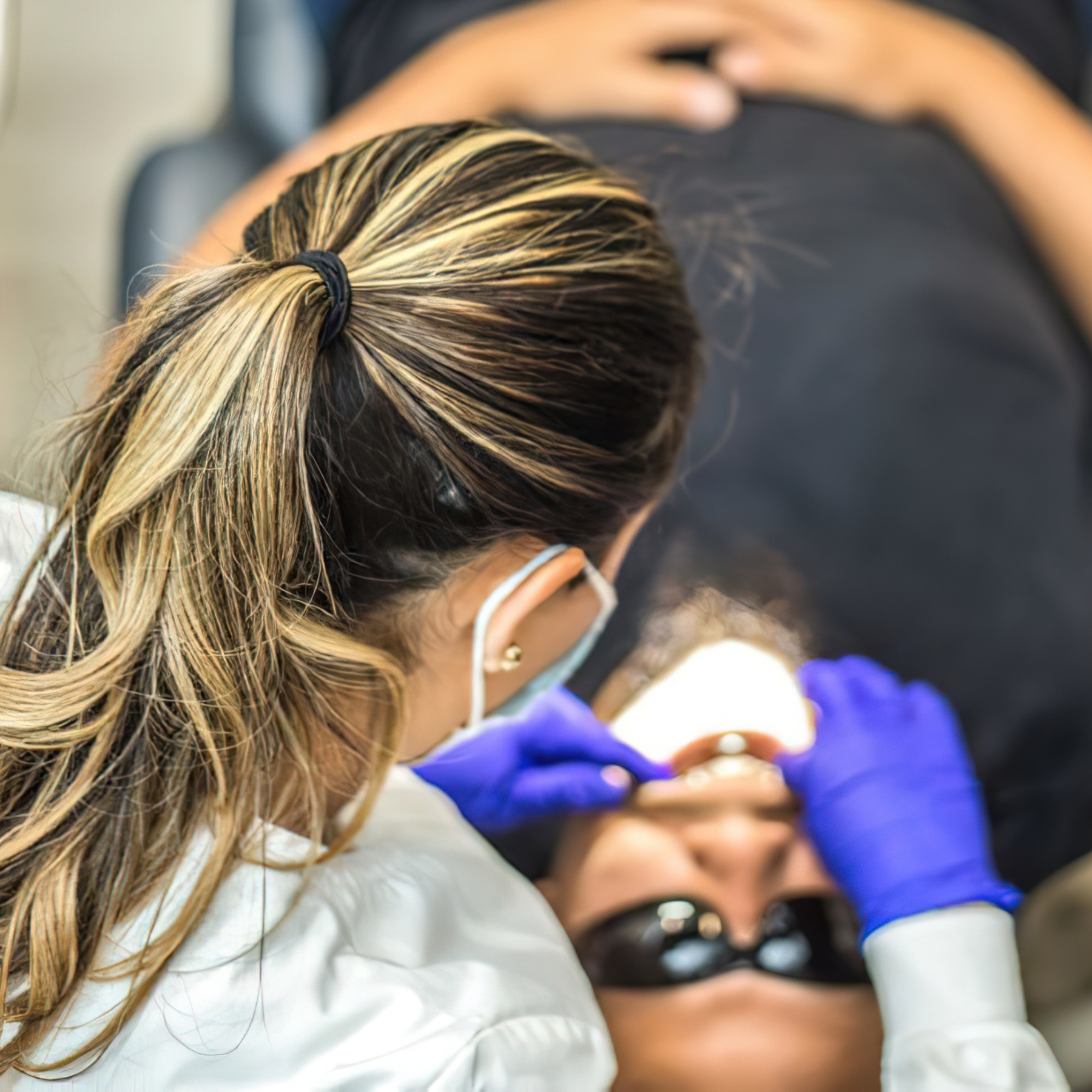 Patient with veneers having a checkup at the dentist