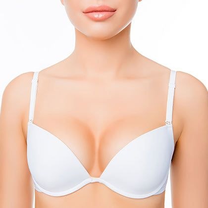 upper body image of a woman wearing a white bra