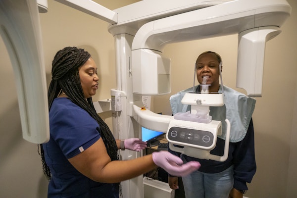 Hygienist and patient taking a 3D scan