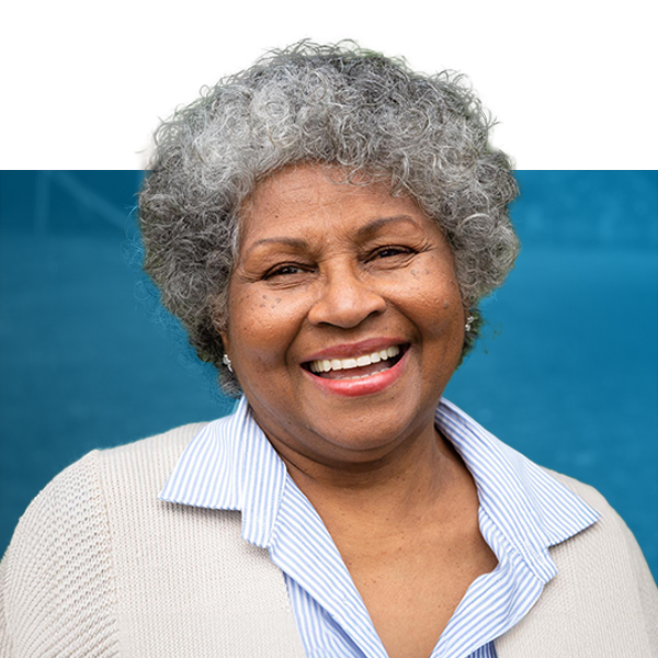 Older woman smiling after a full mouth reconstruction