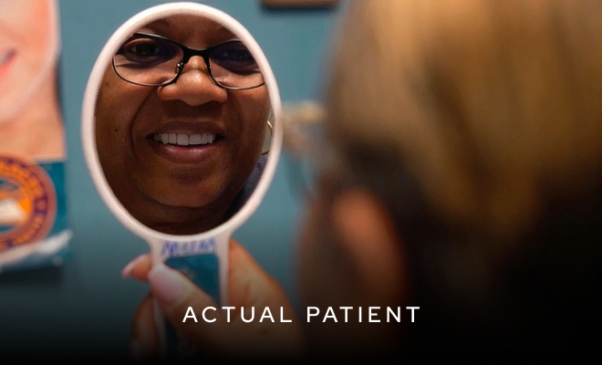 Actual patient smiling in mirror