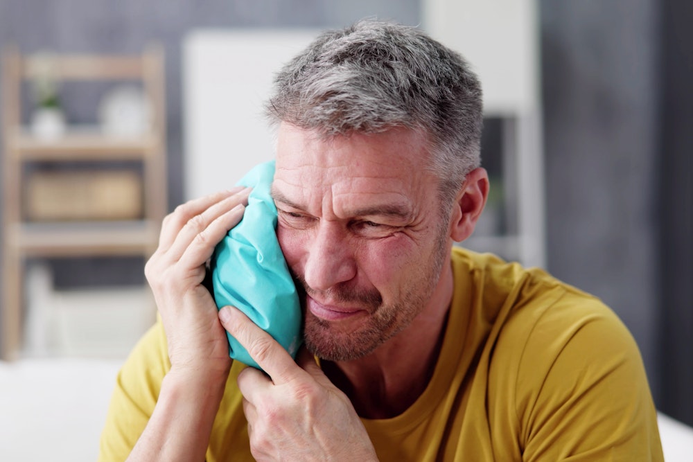 Man in severe dental pain