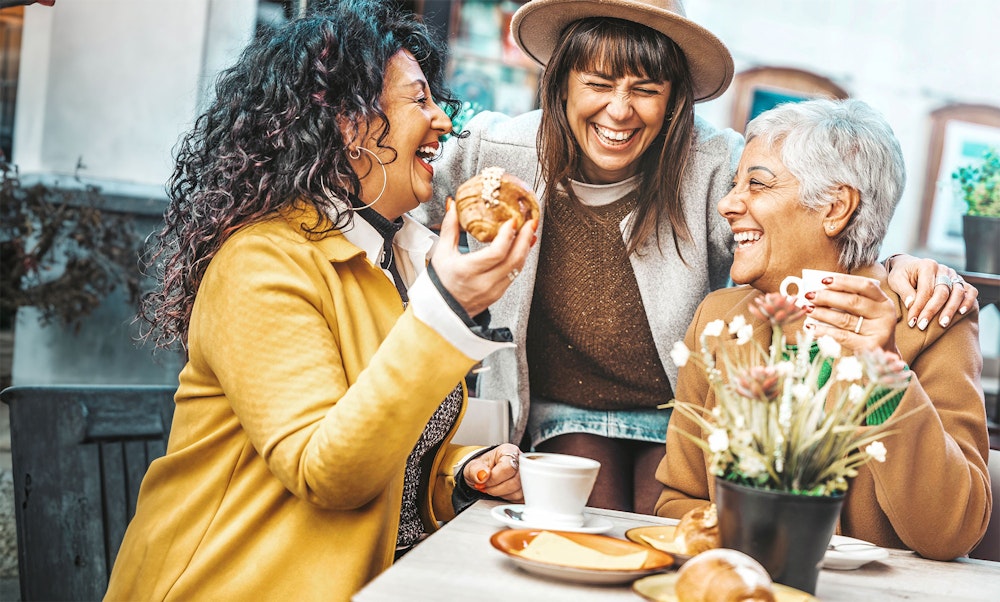 Friends dining out and laughing