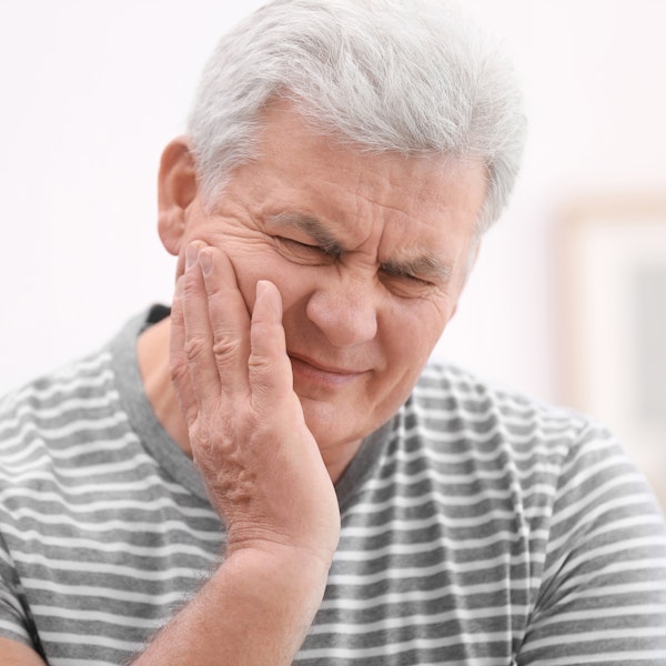 mature man in dental pain