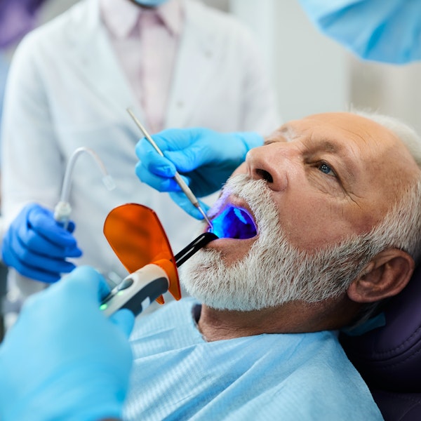mature man getting a dental procedure