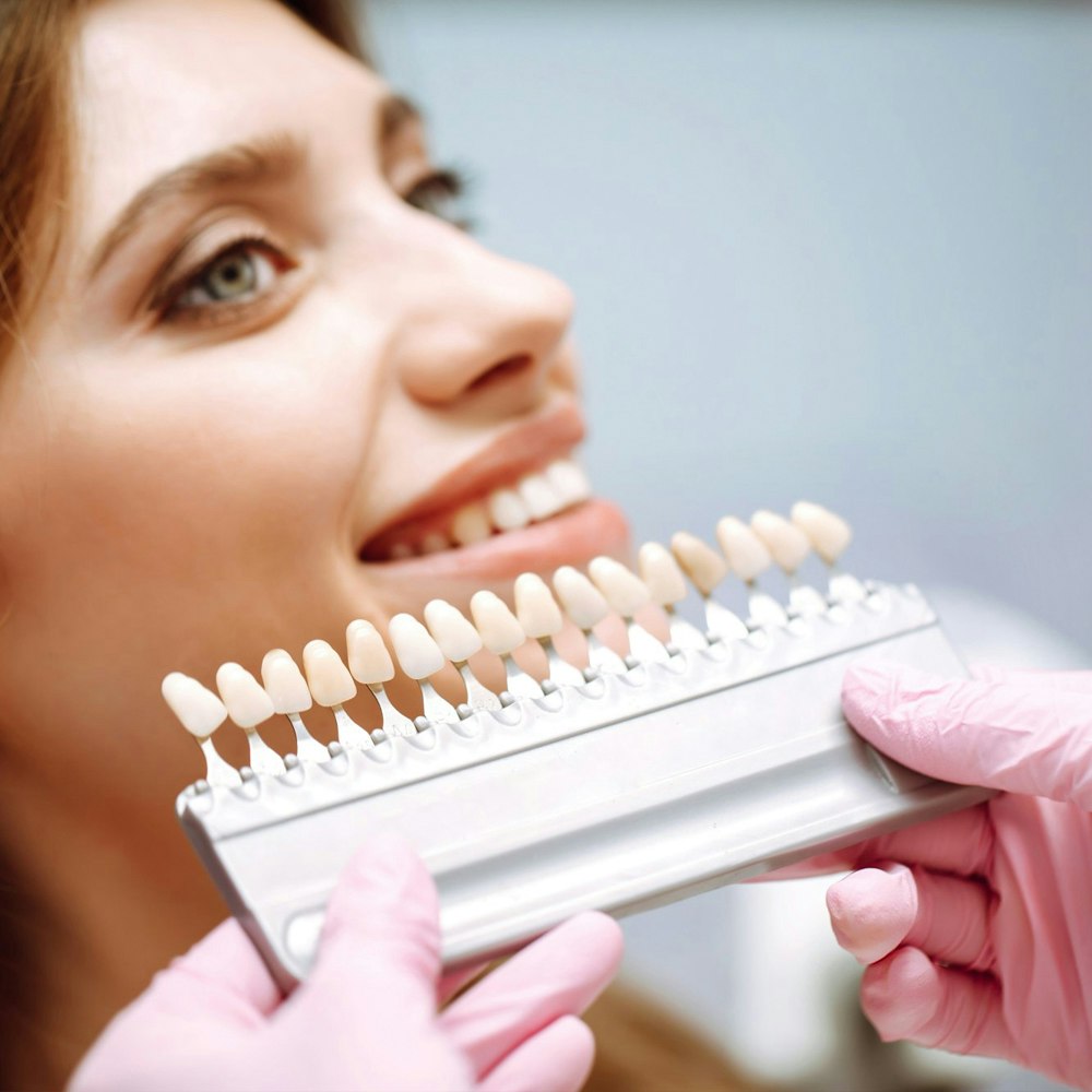 Woman with veneers in the foreground