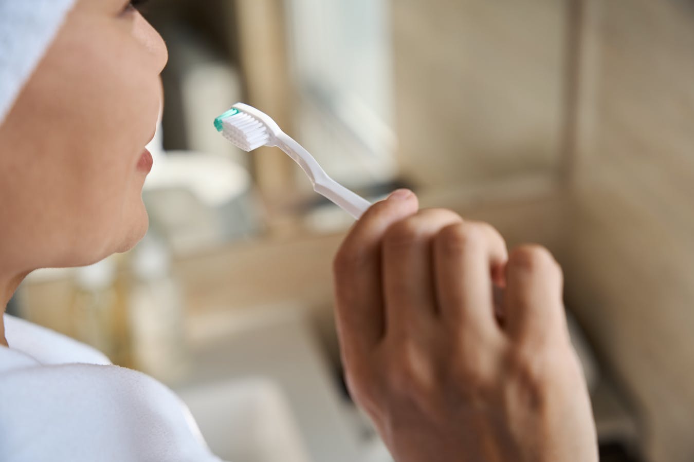 woman brushing her teeth