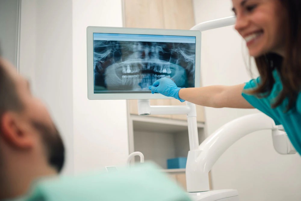 examining a dental x-ray