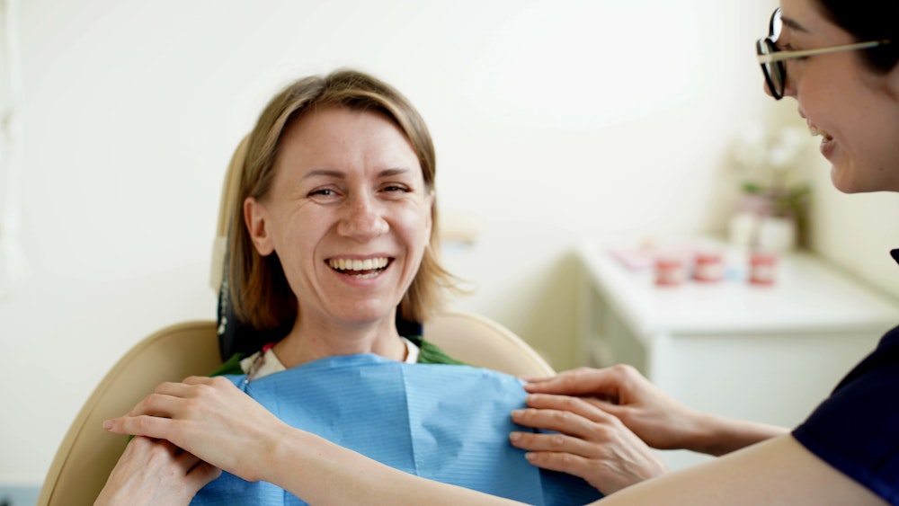 smiling woman in dentist