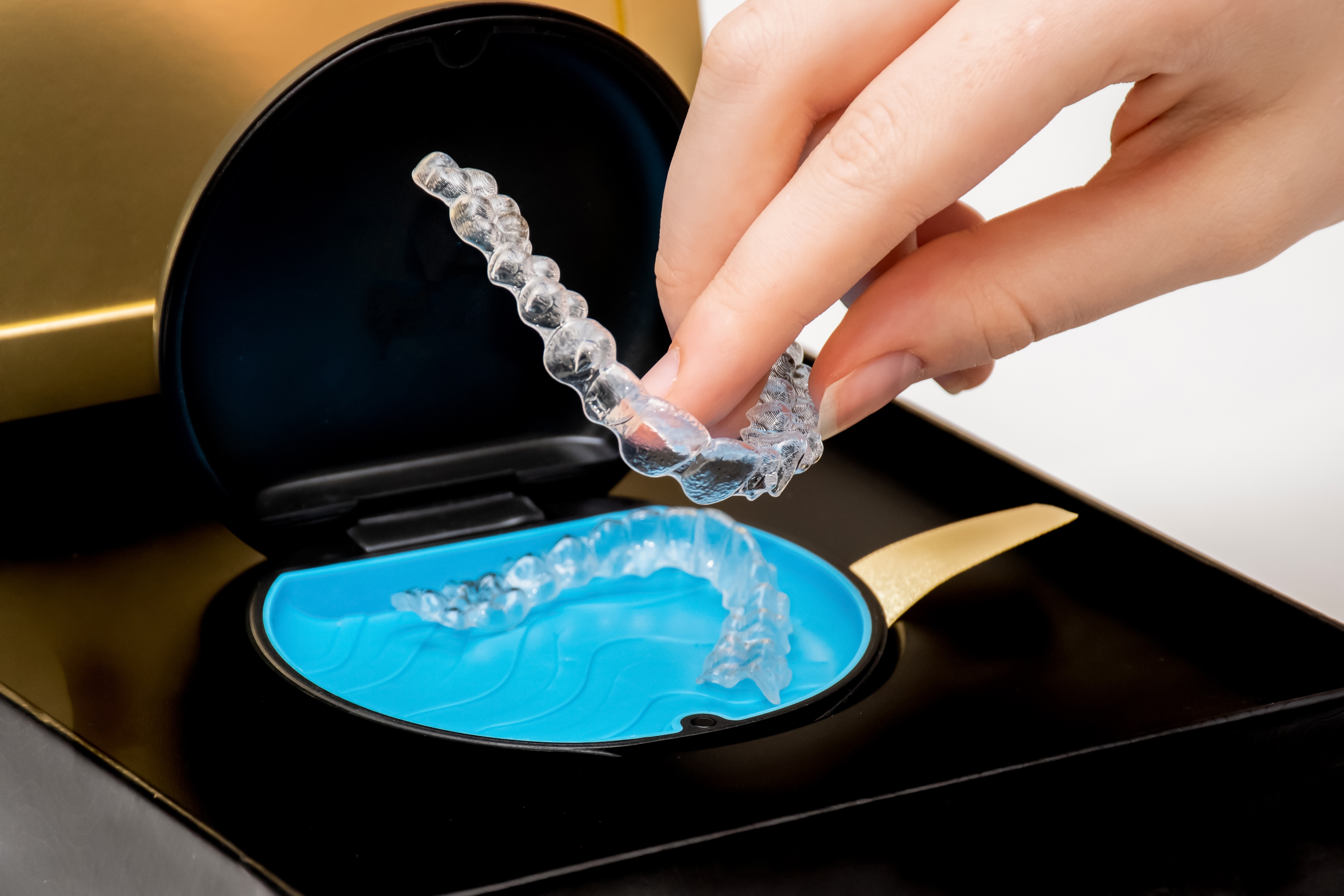 Invisalign aligners being placed in case