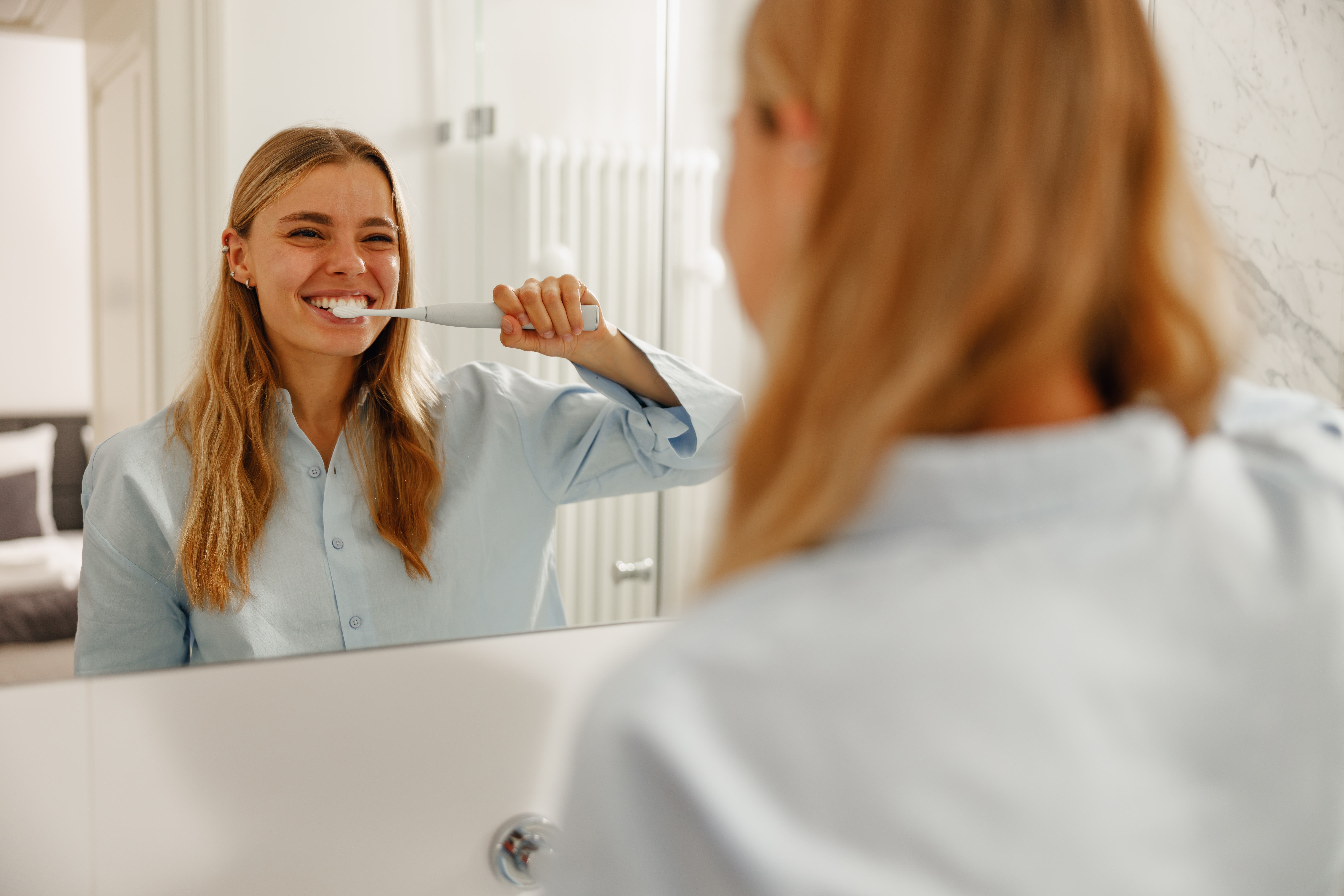Young woman brushing her teeth