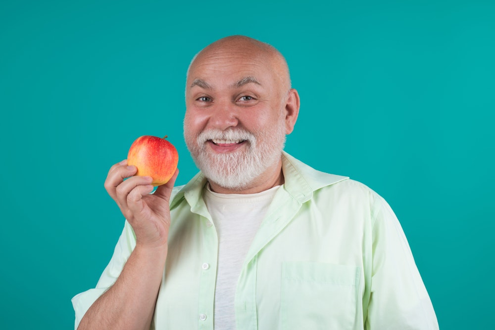 man holding an apple