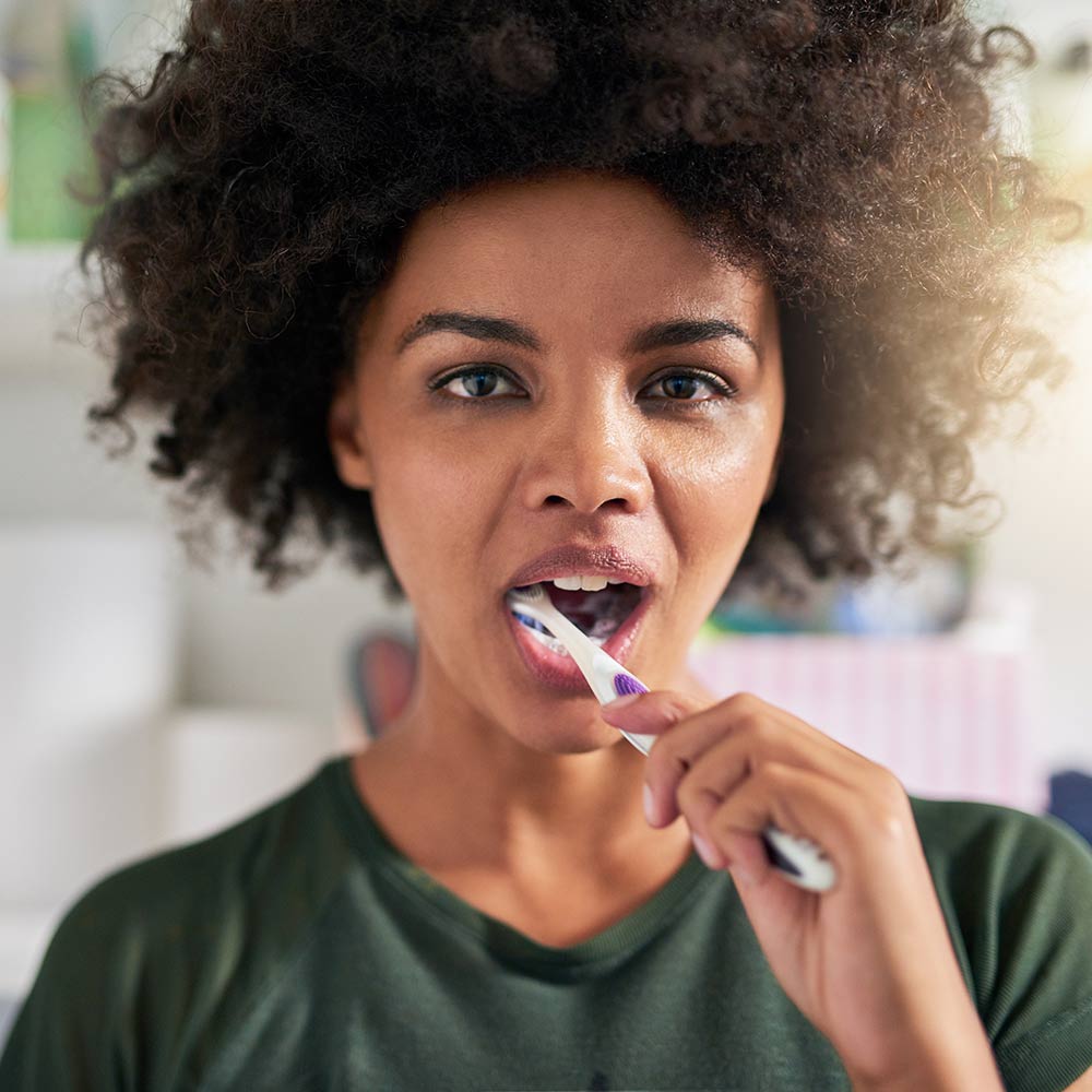 two women smiling outdoors