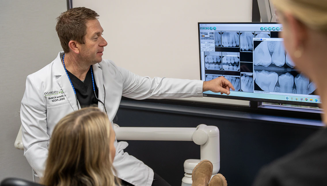 Dr. Krendl reviews dental x-rays with a patient