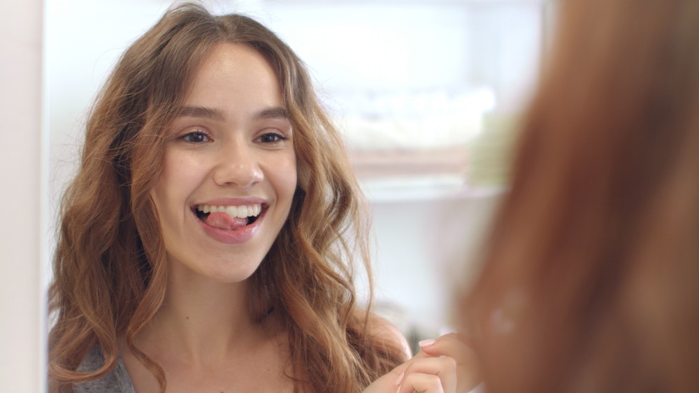 Woman smiling in mirror