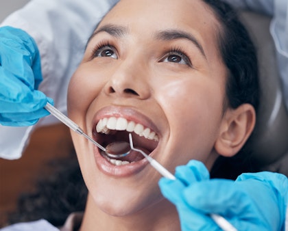 Woman getting her teeth cleaned