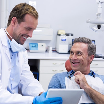 Patient speaking to dentist