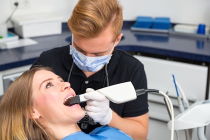 Dentist using primescan on a patient