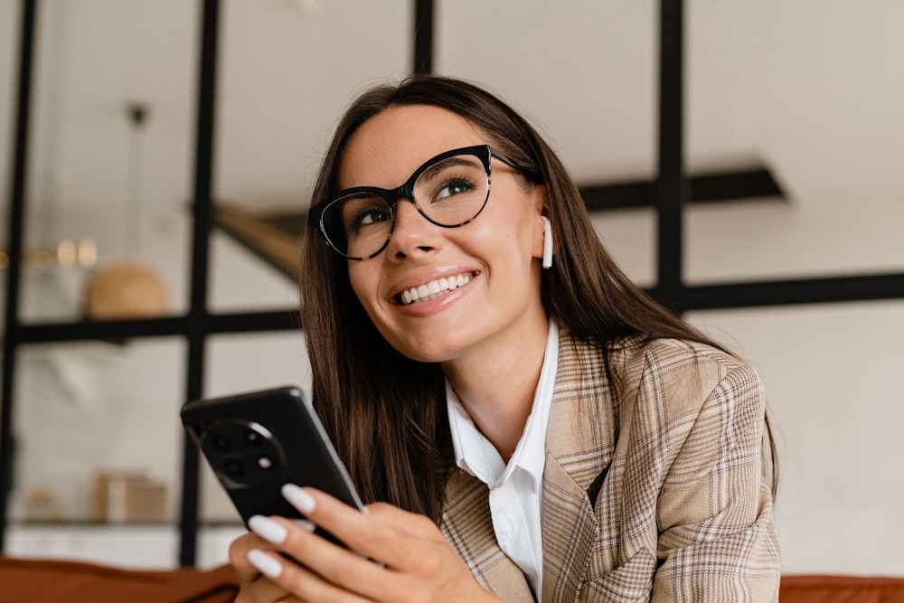 Blonde woman brushing her teeth