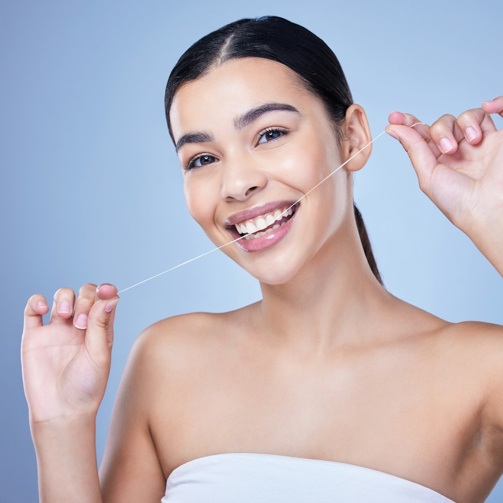 Woman flossing